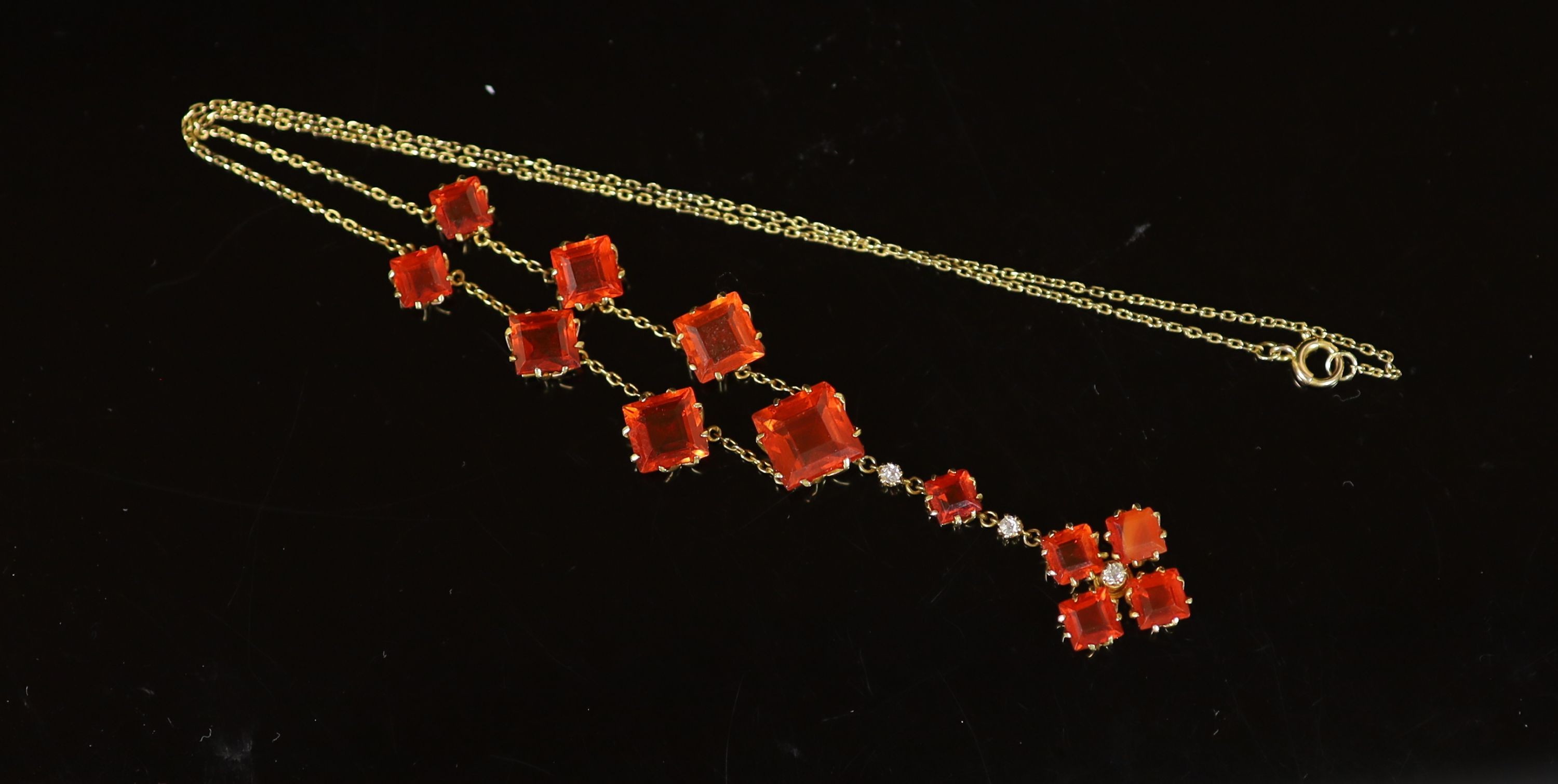 An early 20th century gold, fire opal and diamond drop necklace